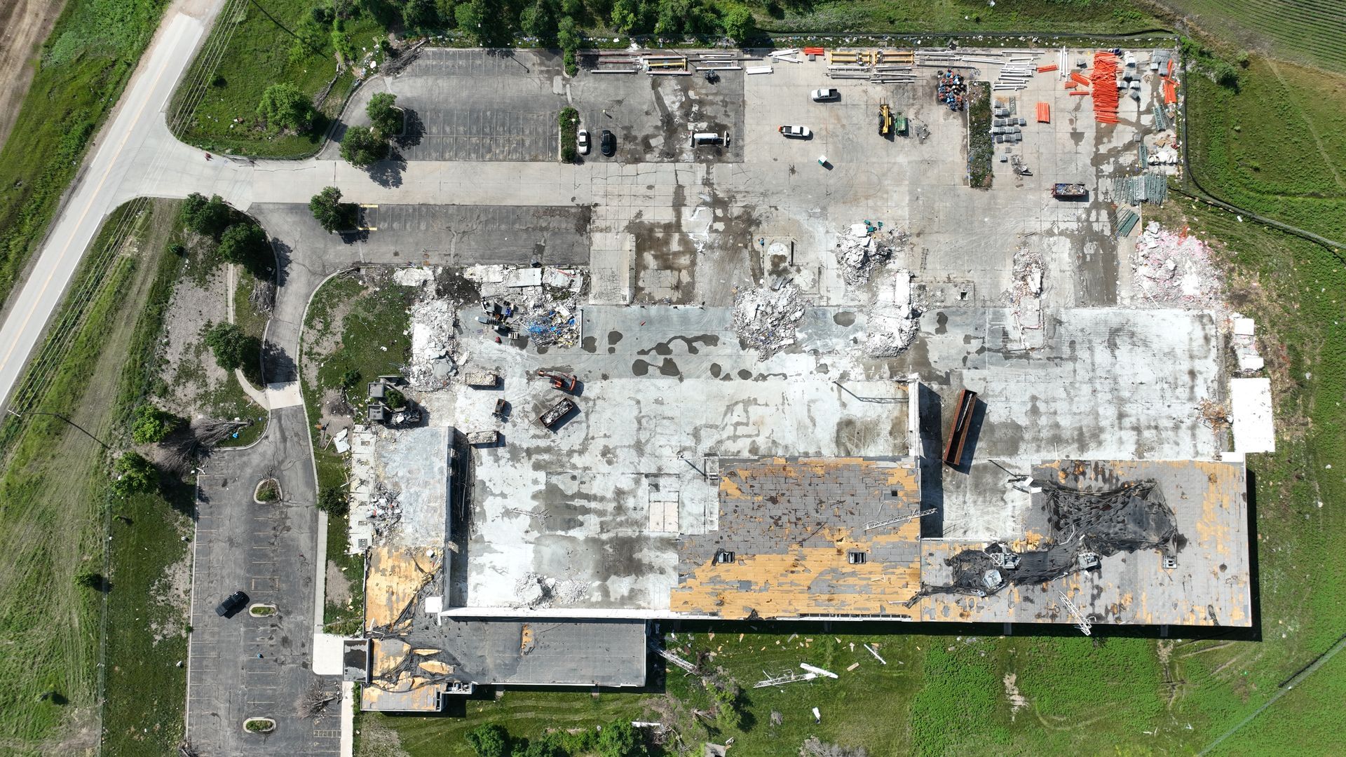 CL Construction crew using excavators to demolish and remove debris from the tornado-destroyed Garner Industries warehouse in Lincoln, Nebraska