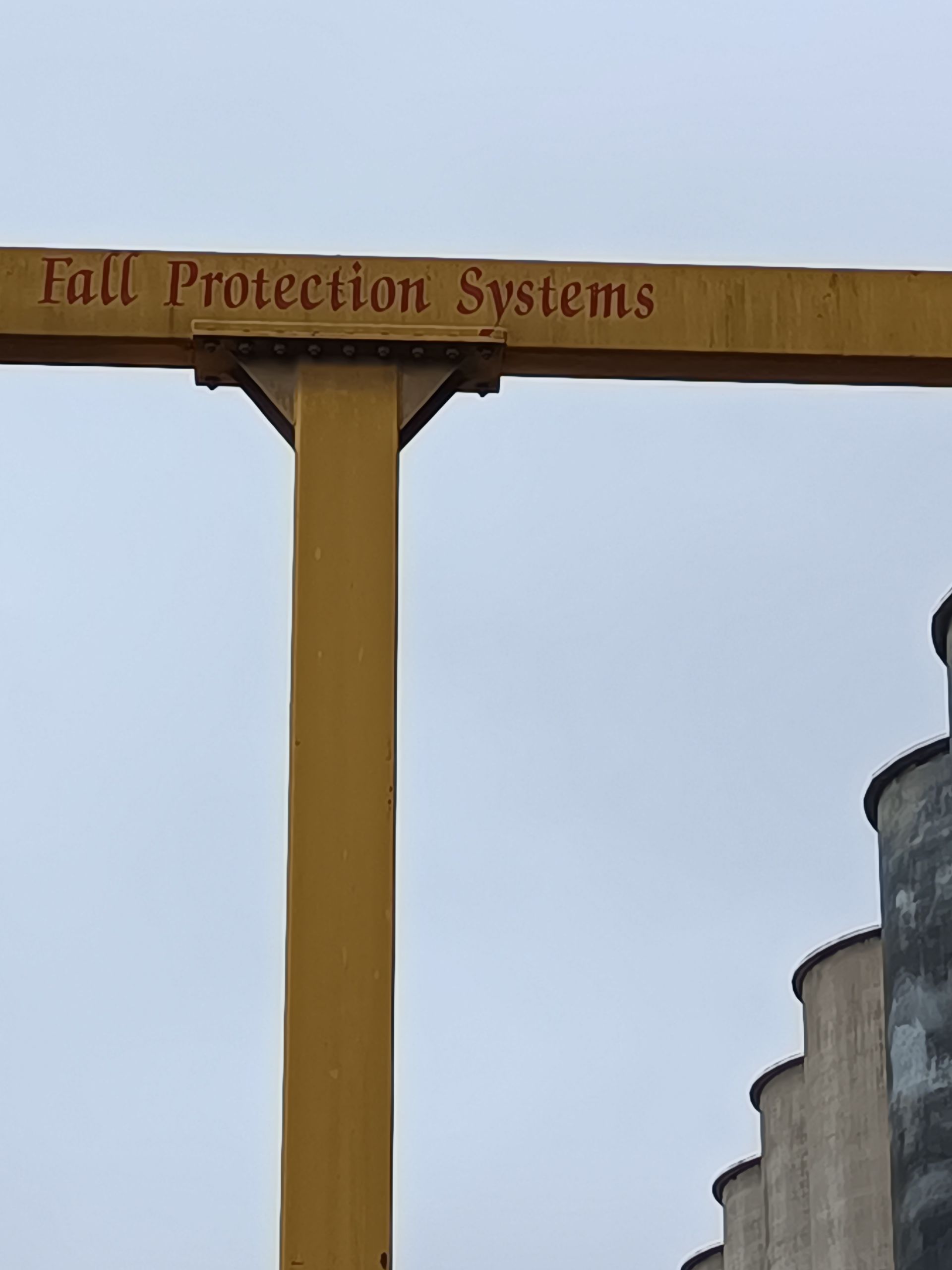 A yellow pole with full protection systems written on it