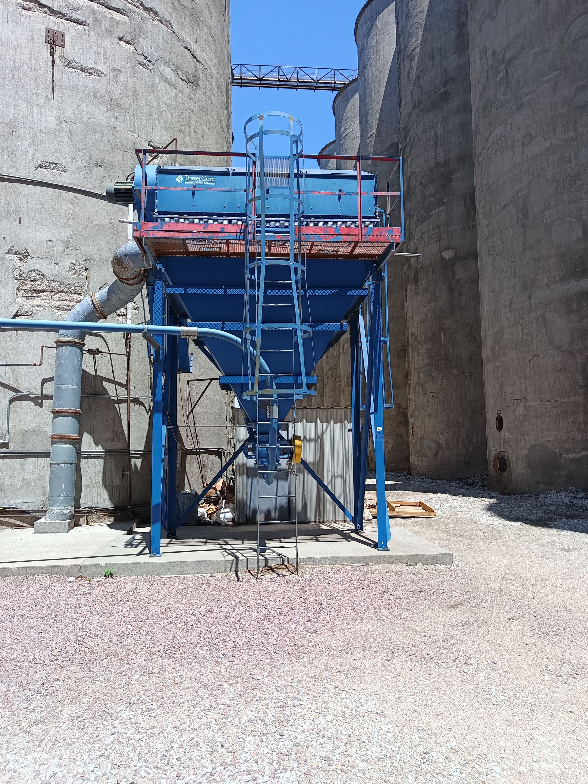 A blue tank with a ladder on top of it