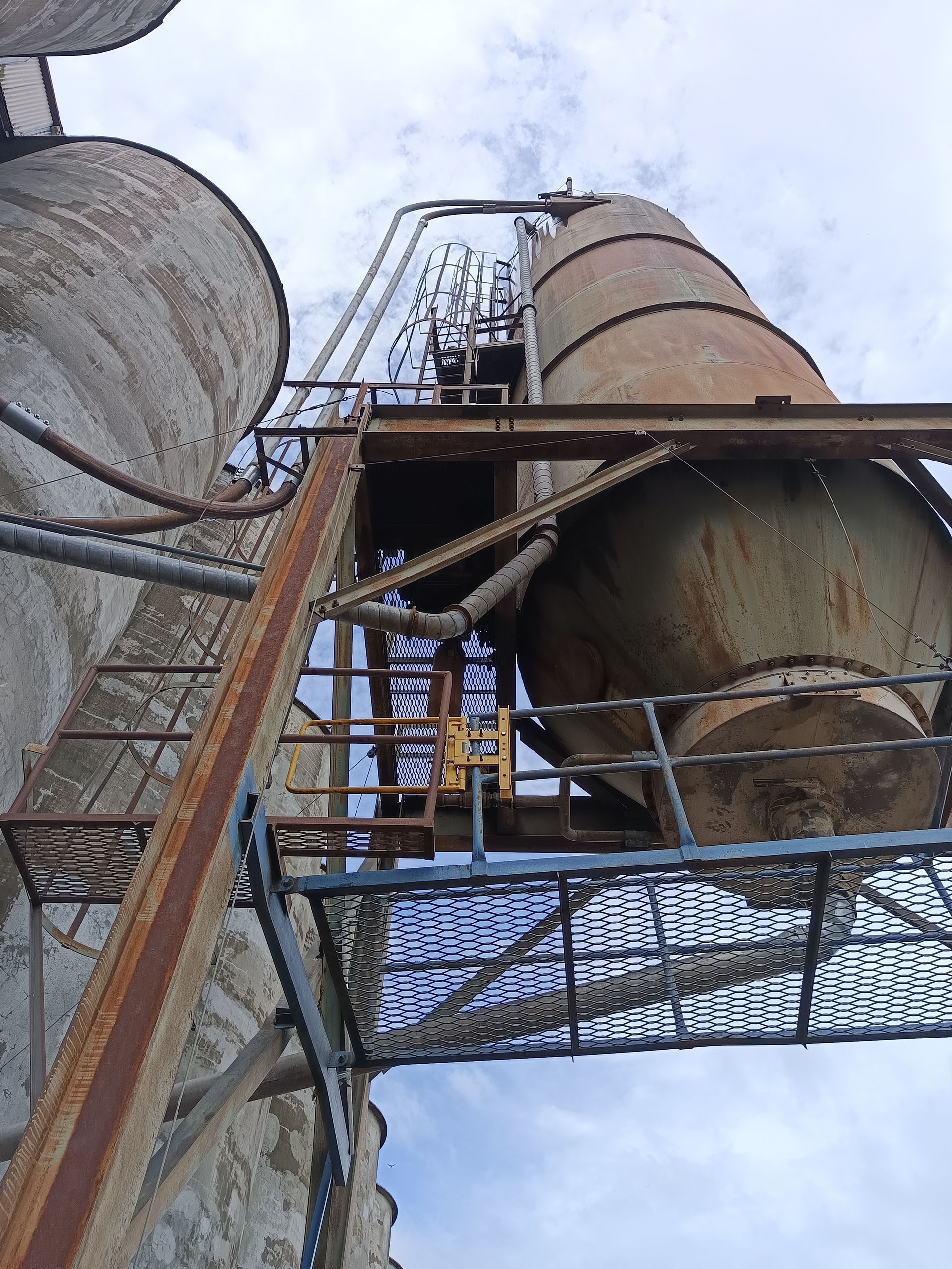 A ladder is going up to a very tall building