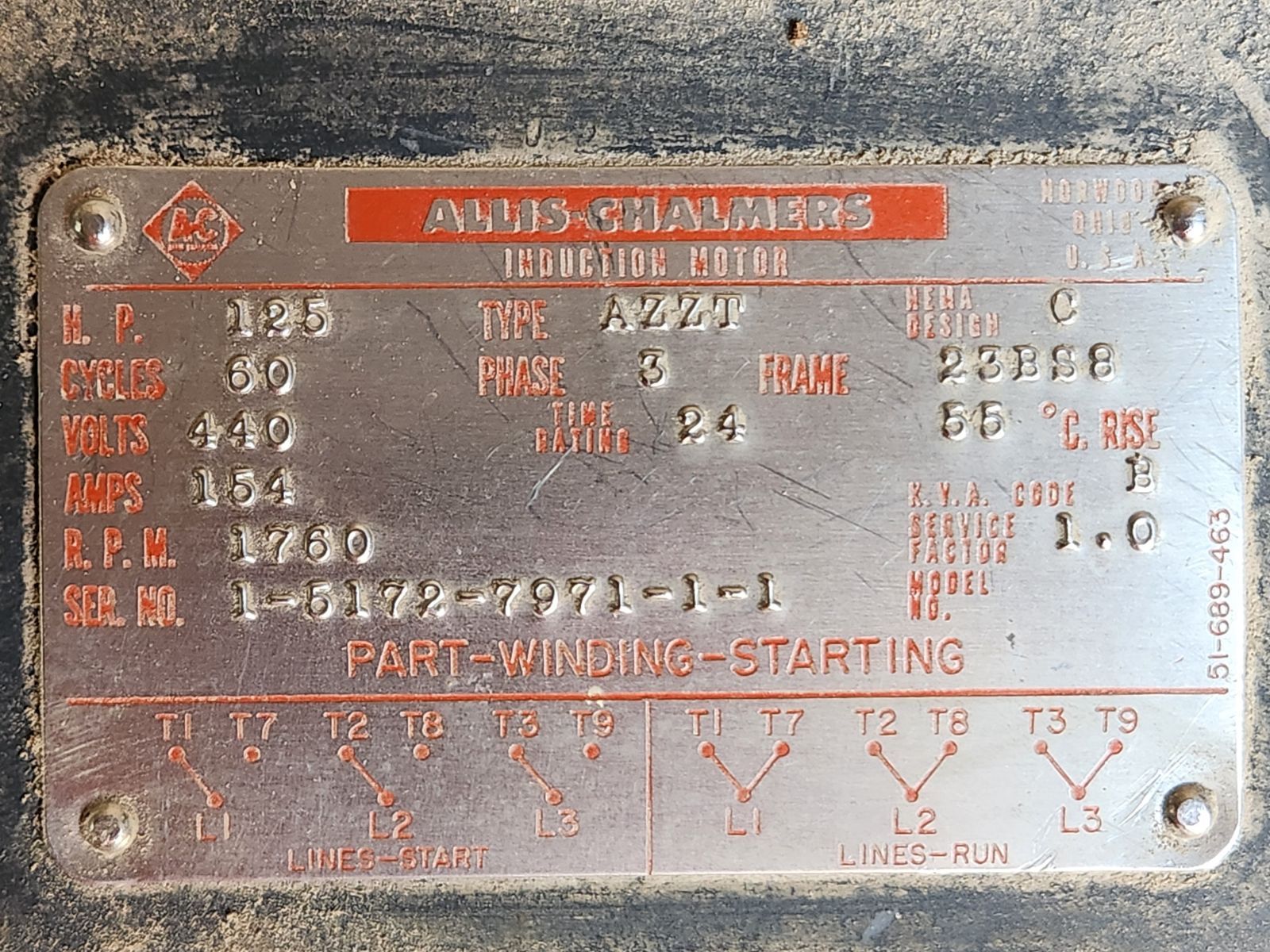 A close up of a part number plate for a motor