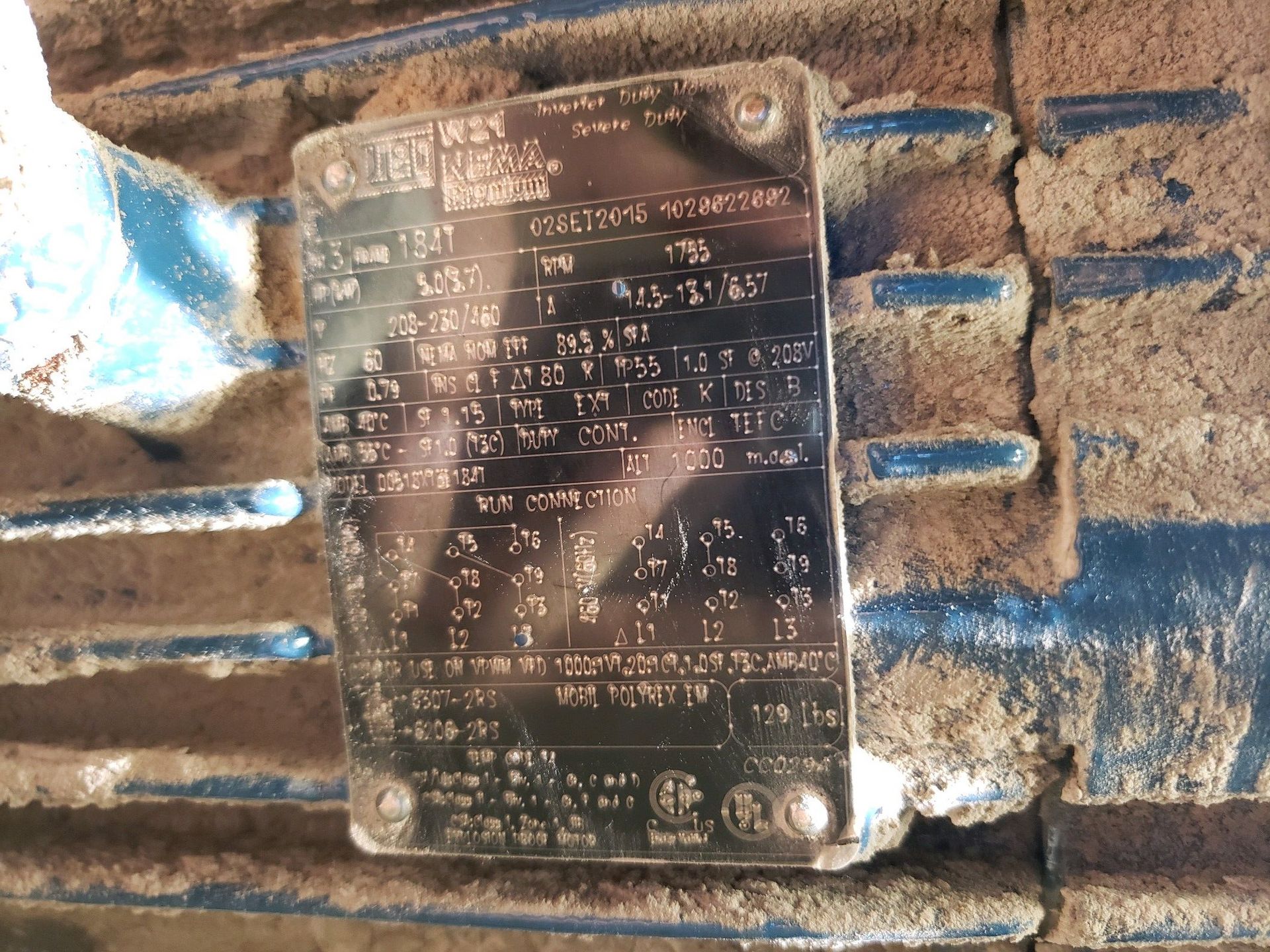 A close up of a metal plate on a machine.