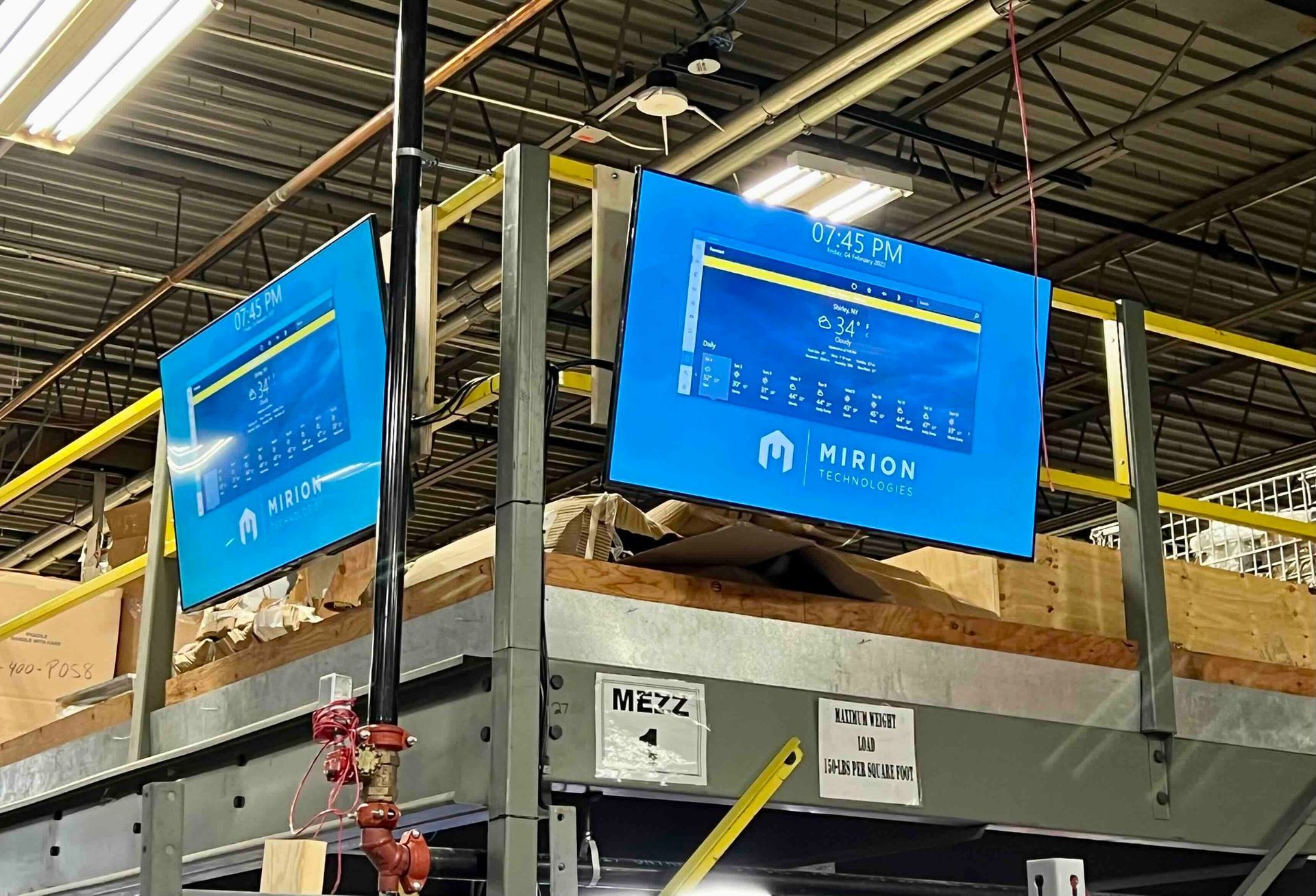 a warehouse with a newly installed two wide monitor
