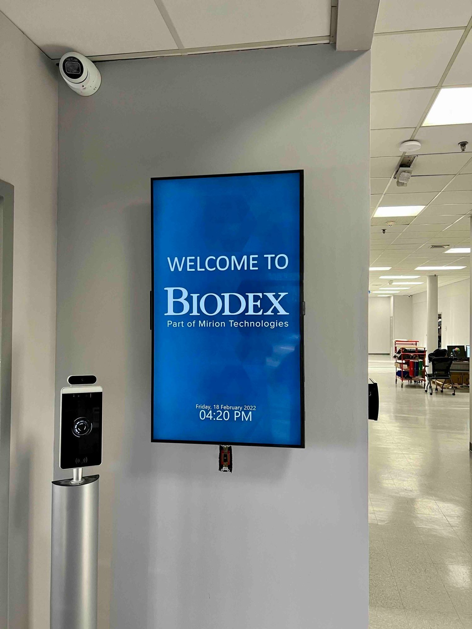 a welcome to biodex sign is hanging on a wall and newly installed monitor screen