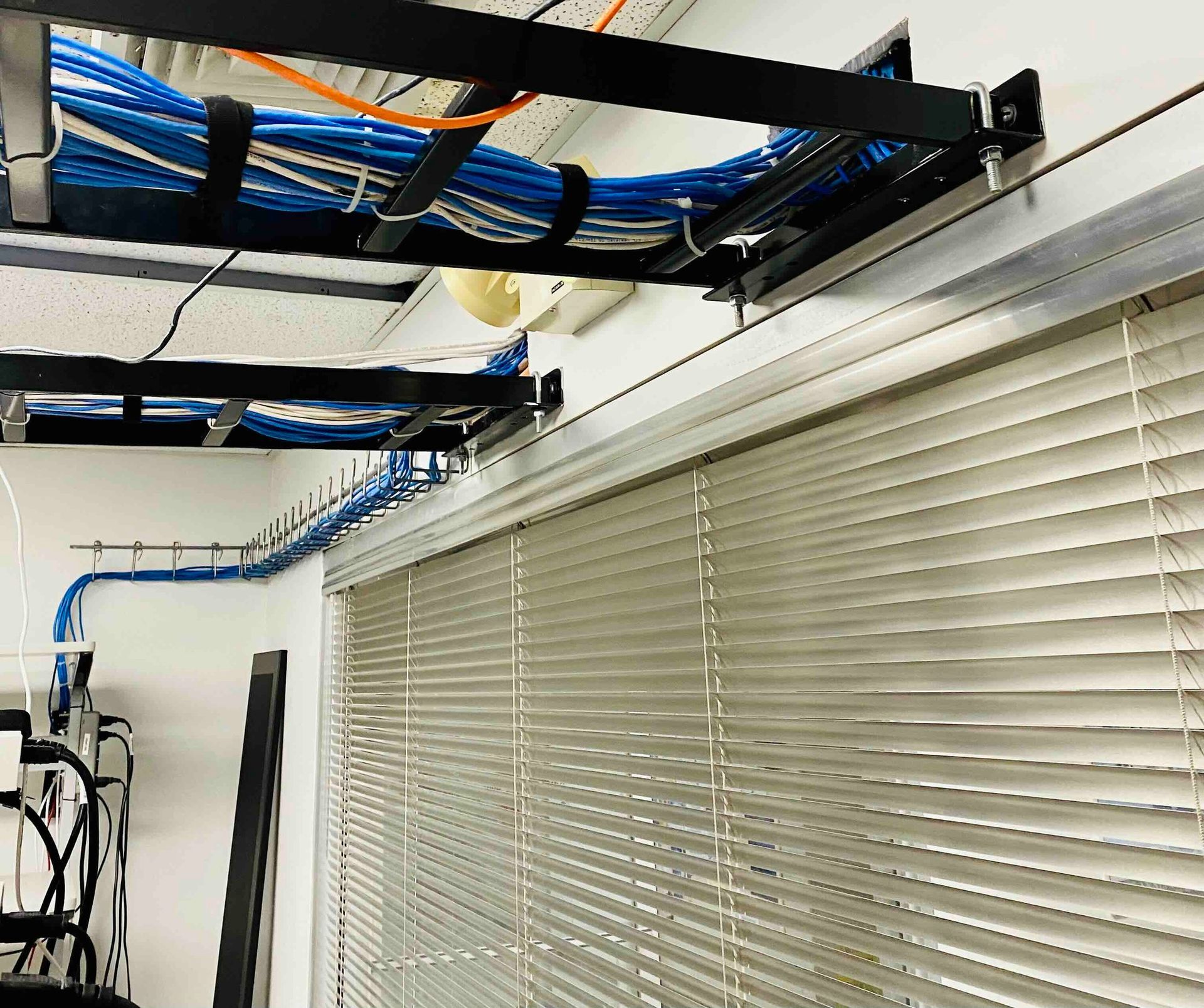 a wooden staircase is being built in a house under construction with the wiring for networking of a commercial establishment