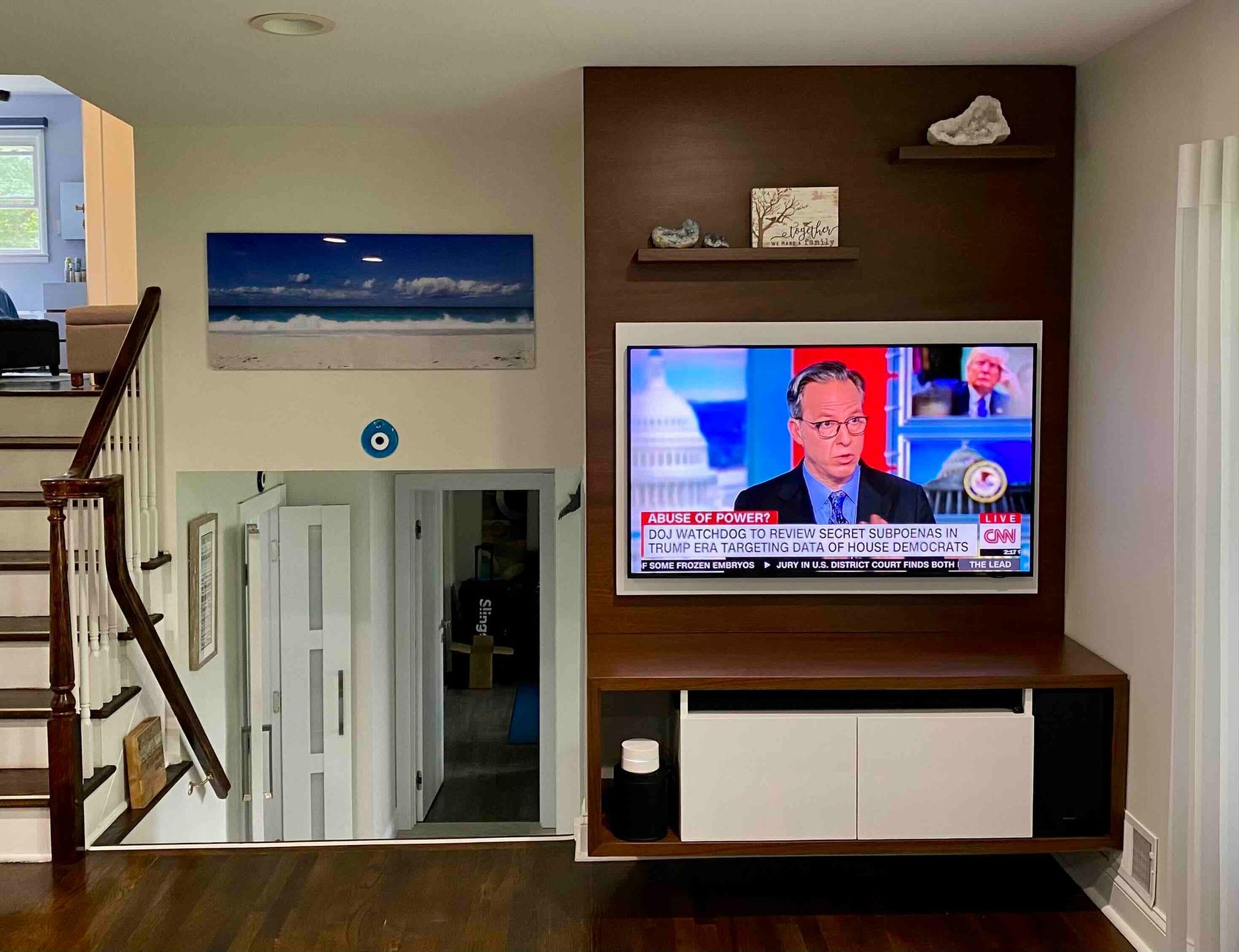 a living room with a newly installed flat screen tv on the wall