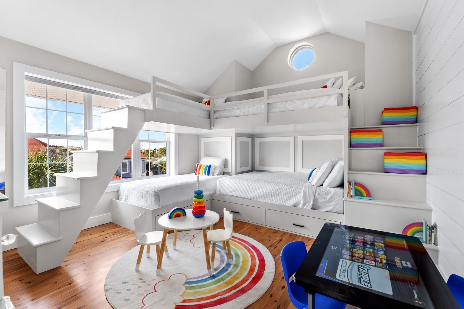 A bathroom with two sinks and a large mirror.