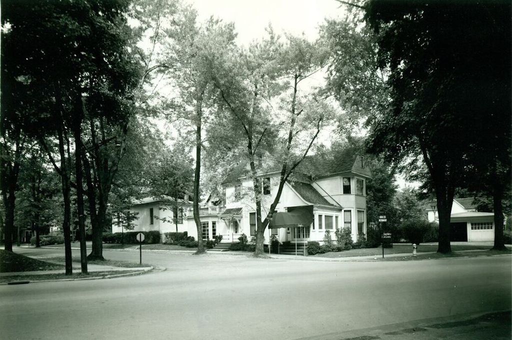 A black and white photo of a row of houses