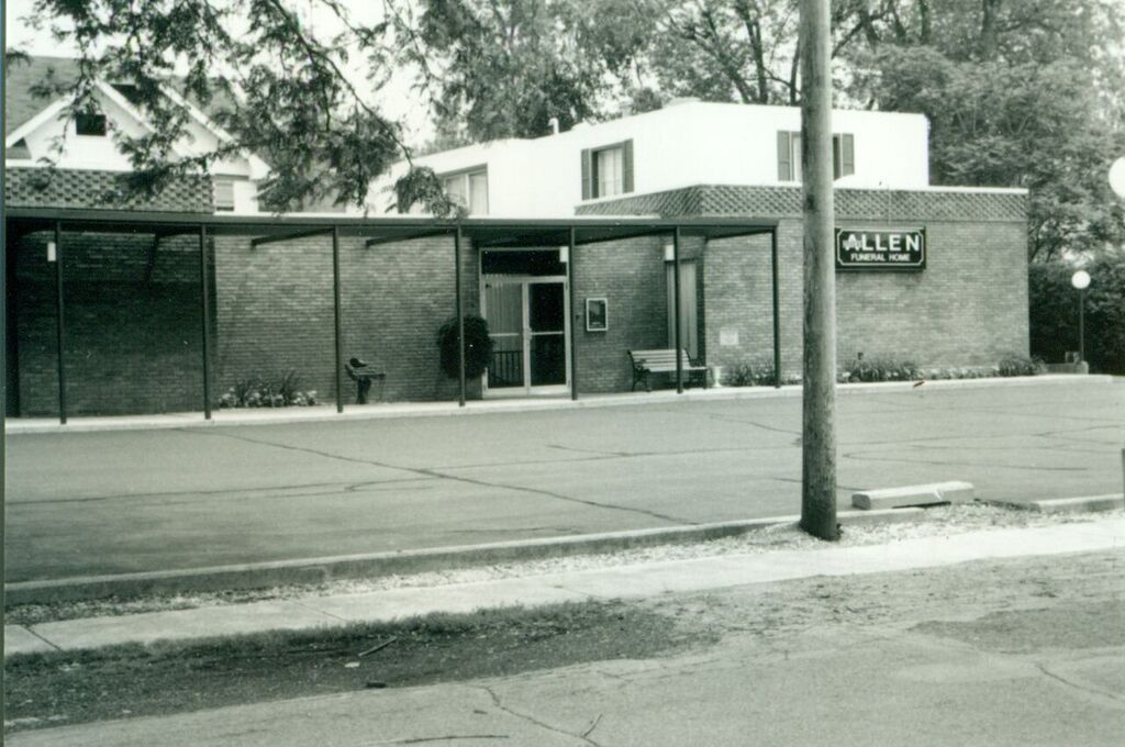 A black and white photo of an allen building
