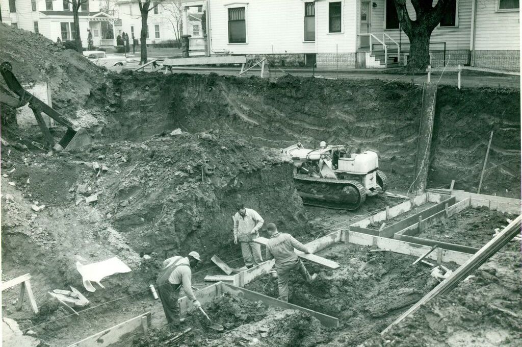 A black and white photo of a construction site