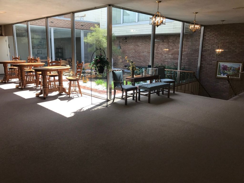 A large room with tables and chairs in it