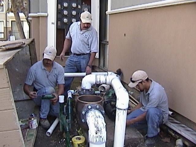 Water Recreation employees working on pipework