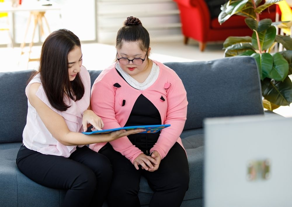 A Nurse Is Talking to An Elderly Woman in A Wheelchair — Respite Care in Ballarat, VIC