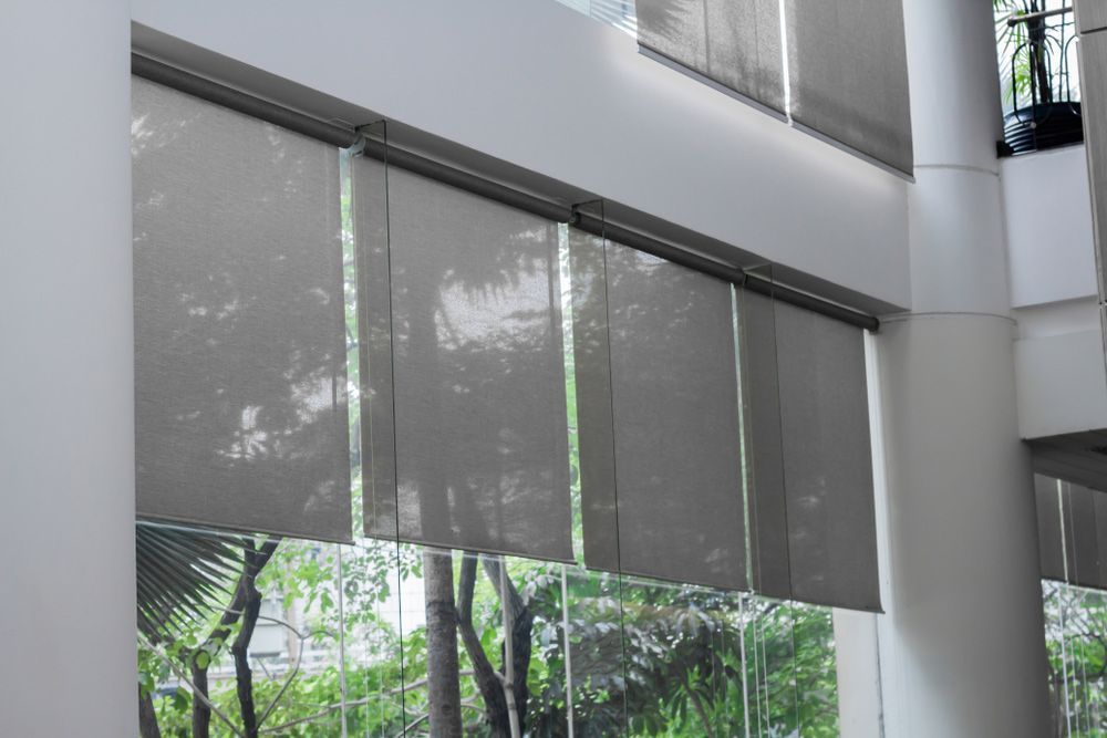 A Large Window With A Lot Of Blinds On It — Gaeta's Upholstery Blinds & Awnings in Grafton, NSW
