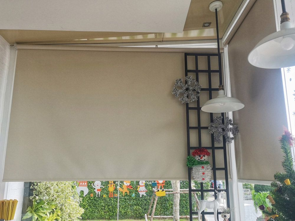 There Is A Christmas Tree And A Christmas Wreath On The Wall — Gaeta's Upholstery Blinds & Awnings in Yamba, NSW