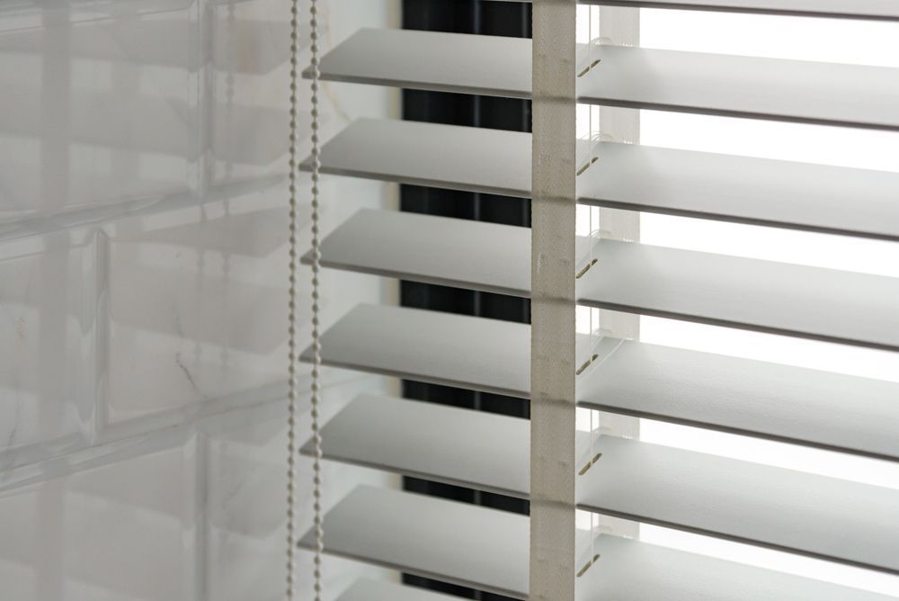 A Close Up Of A Window With Blinds On It — Gaeta's Upholstery Blinds & Awnings in Grafton, NSW