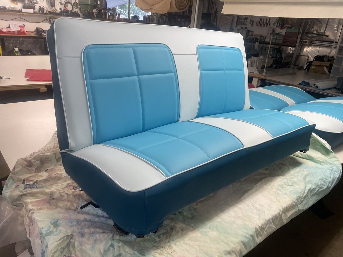 A Fishing Chair On A Boat With Fishing Rods In The Ocean — Gaeta's Upholstery Blinds & Awnings in Grafton, NSW