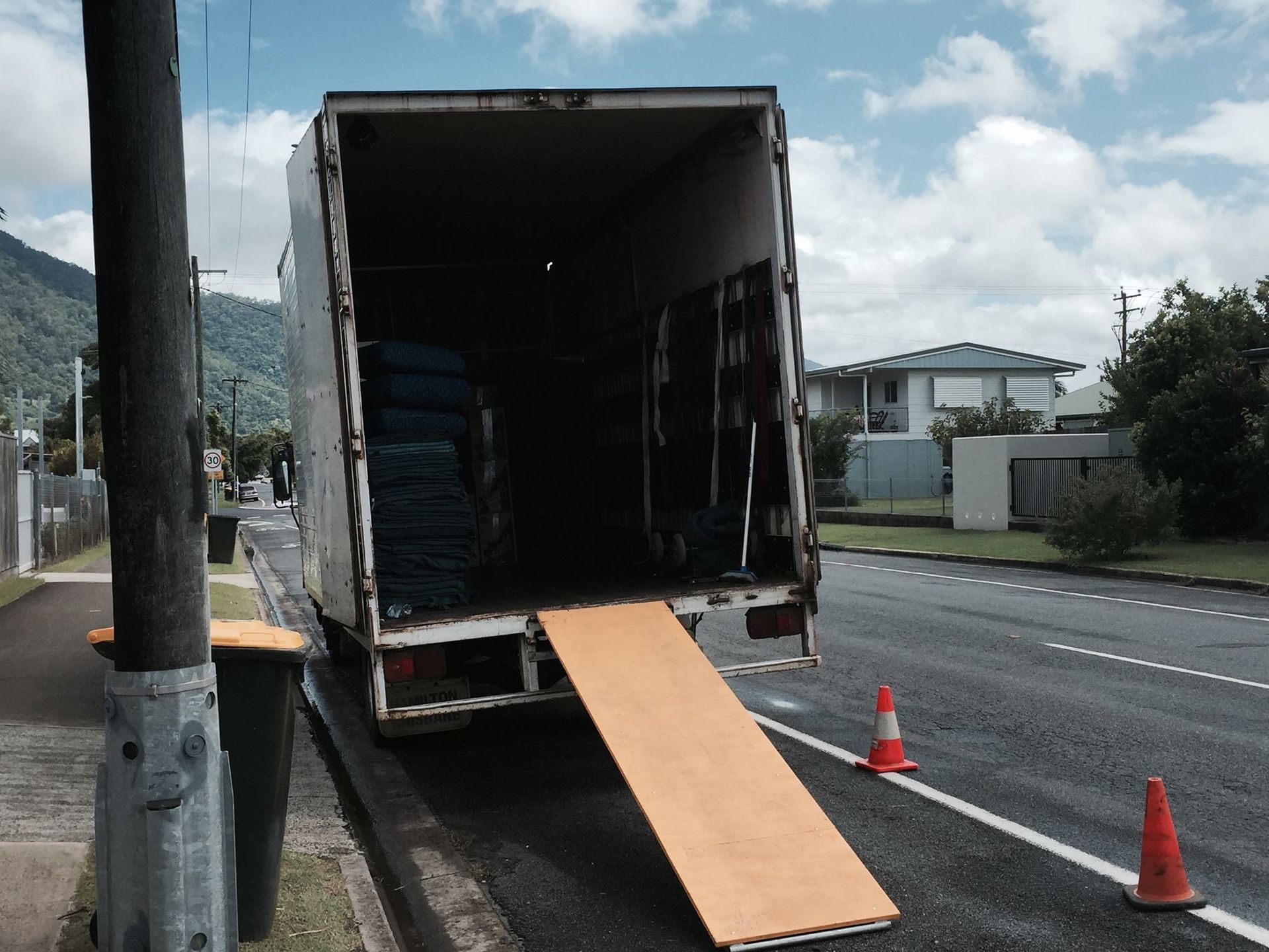 Two Individuals Carry Cardboard Boxes — Cairns Mini Movers In Mount Sheridan, QLD
