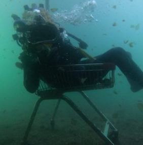 Diver sitting in a chair underwater