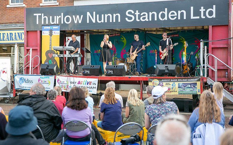 People watching the band at the Fakenham Music Festival