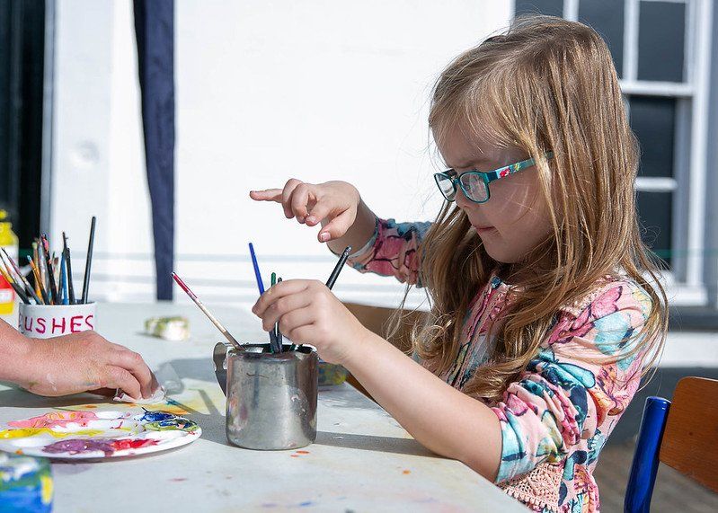 Little girl doing some craft activities at the Fakenham Music Festival