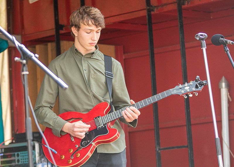 Man playing guitar at the Fakenham Music Festival