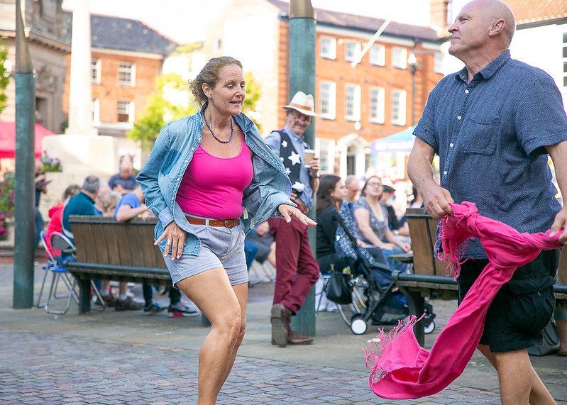 A couple dancing and enjoying the music at the Fakenham Music Festival