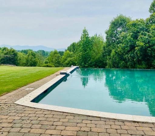 A large swimming pool installed by Caroline Pool Plastering in Huntsville, NC