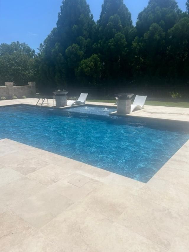 A large inground swimming pool installed by Caroline Pool Plastering in Huntsville, NC
