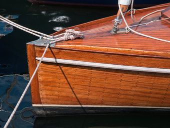 Small boat stern made completely of refinished teak