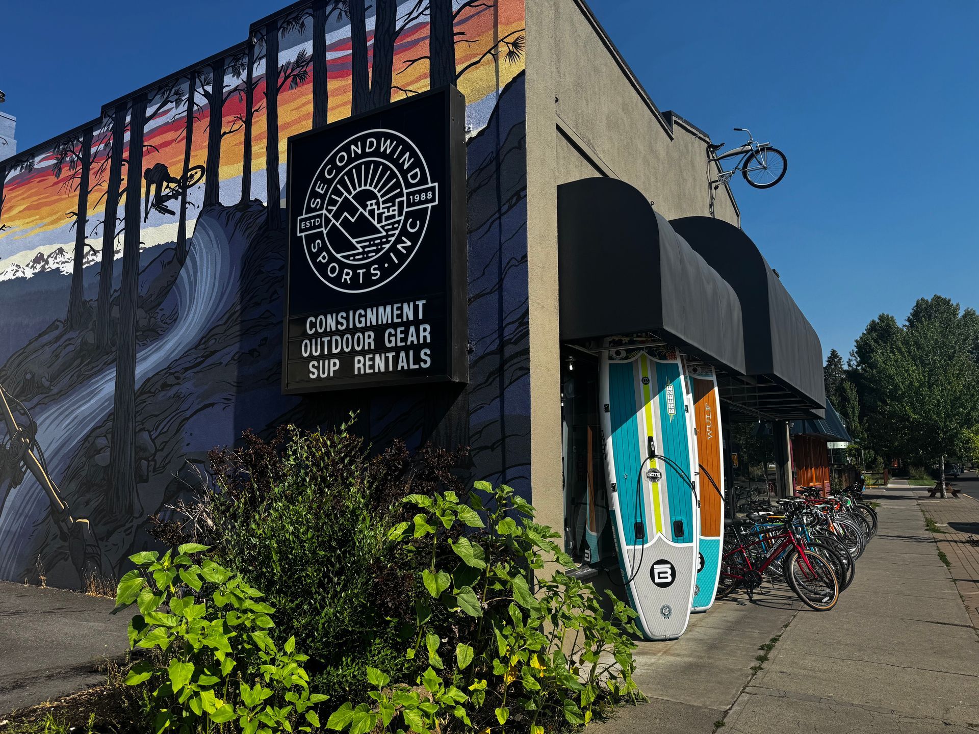 A building with a sign that says ' consignment outdoor gear ' on it