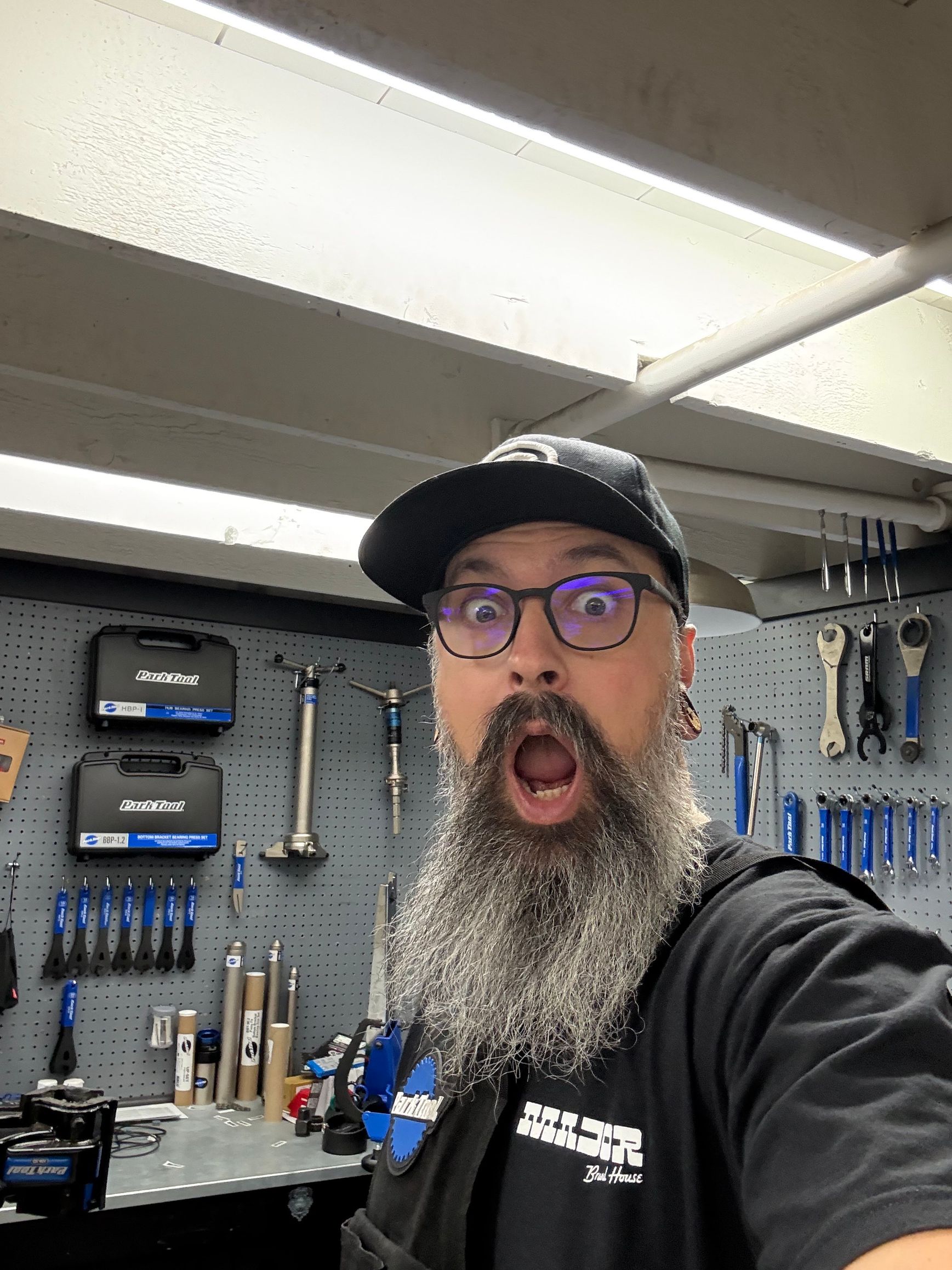 Two people standing in front of a second wind sports store