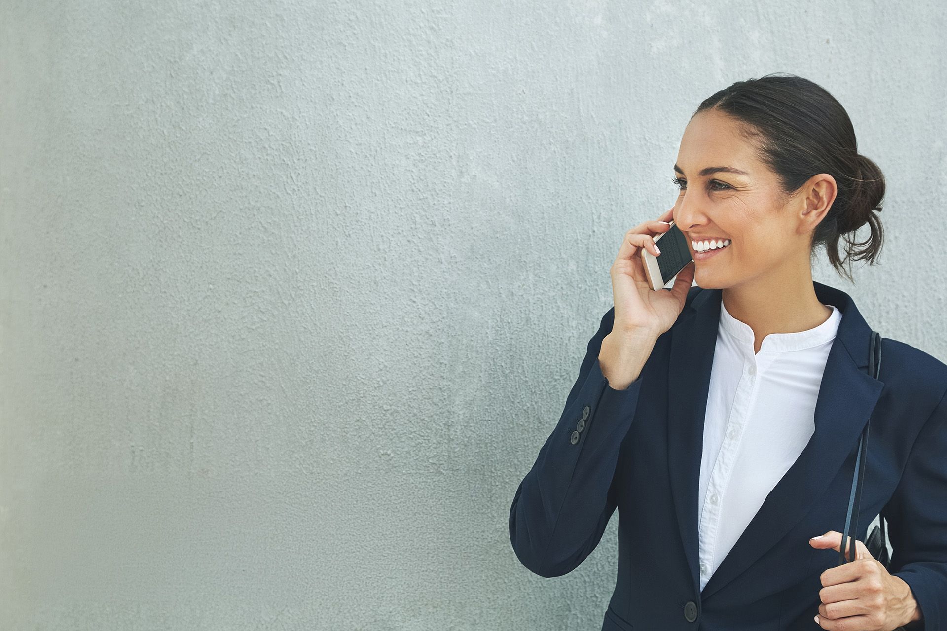 Estate agent on phone with logos for Alto and CRE Group