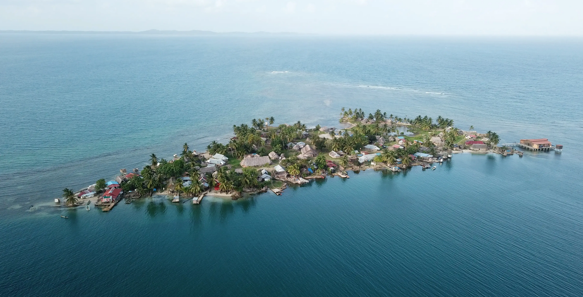 An aerial view of a small island in the middle of the ocean.