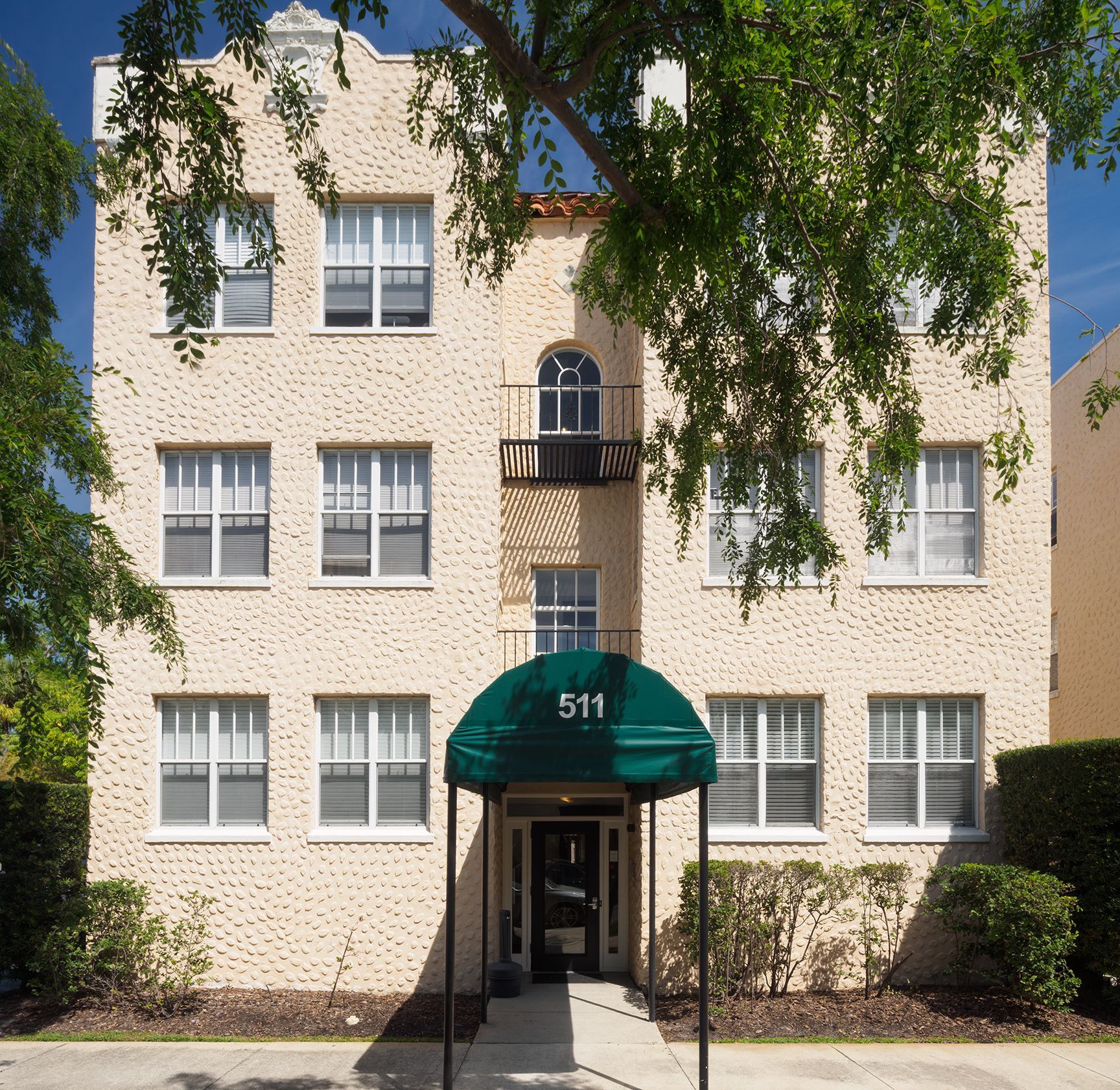 Photo of the entrance to a building, showing an overhang