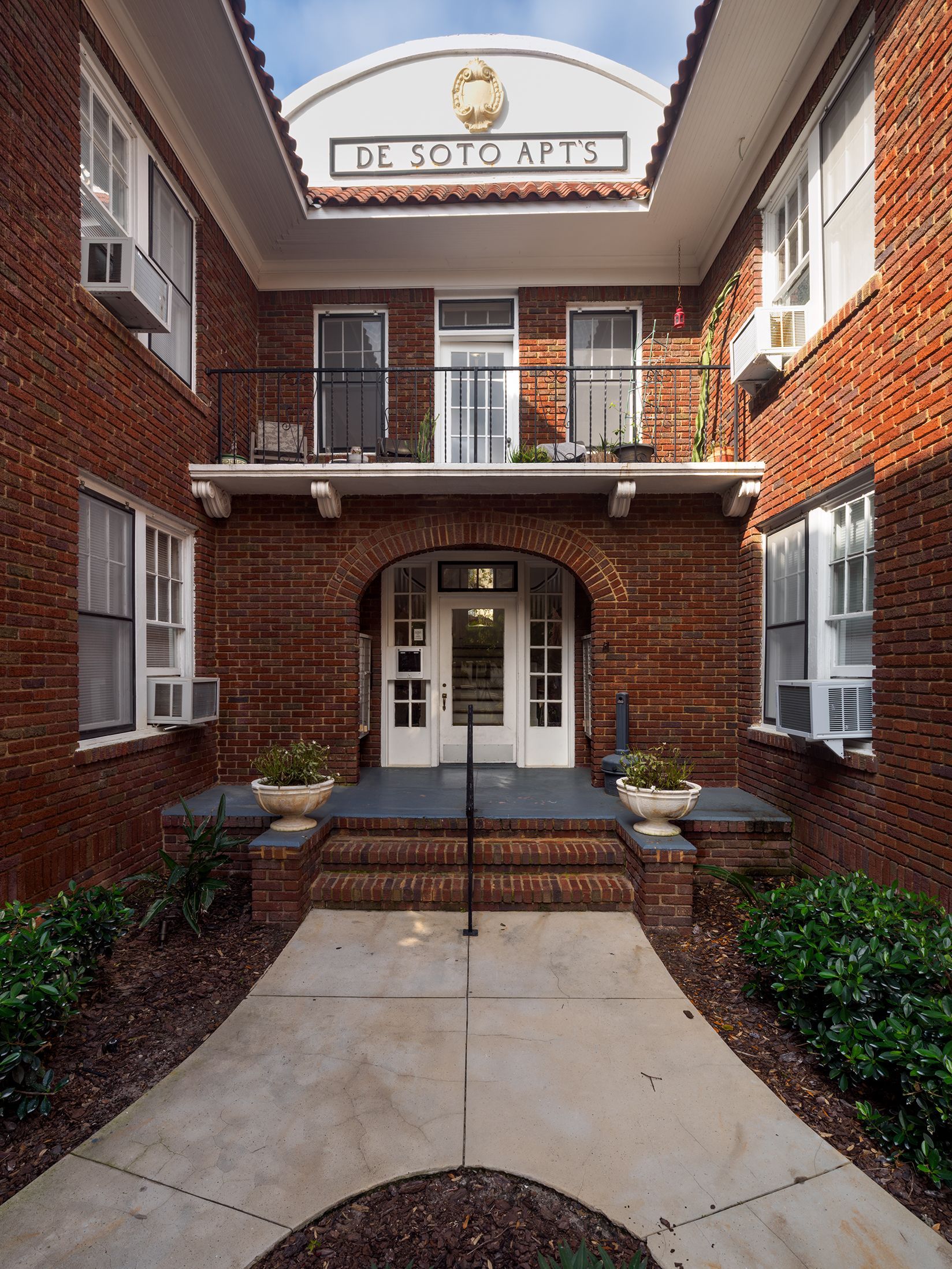 Photo of the courtyard area approaching an entrance to the building