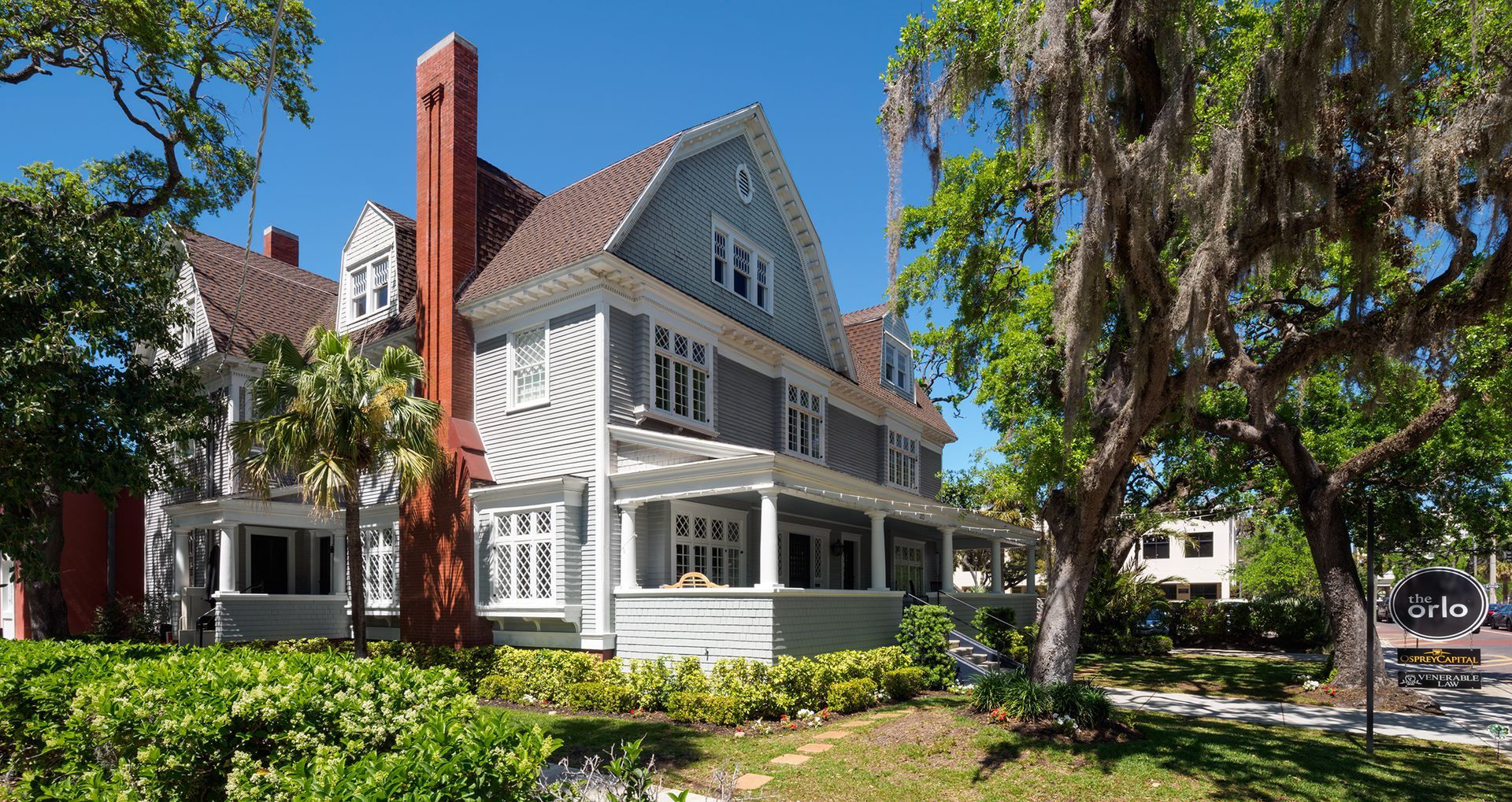Photo of a three story home with a front porch
