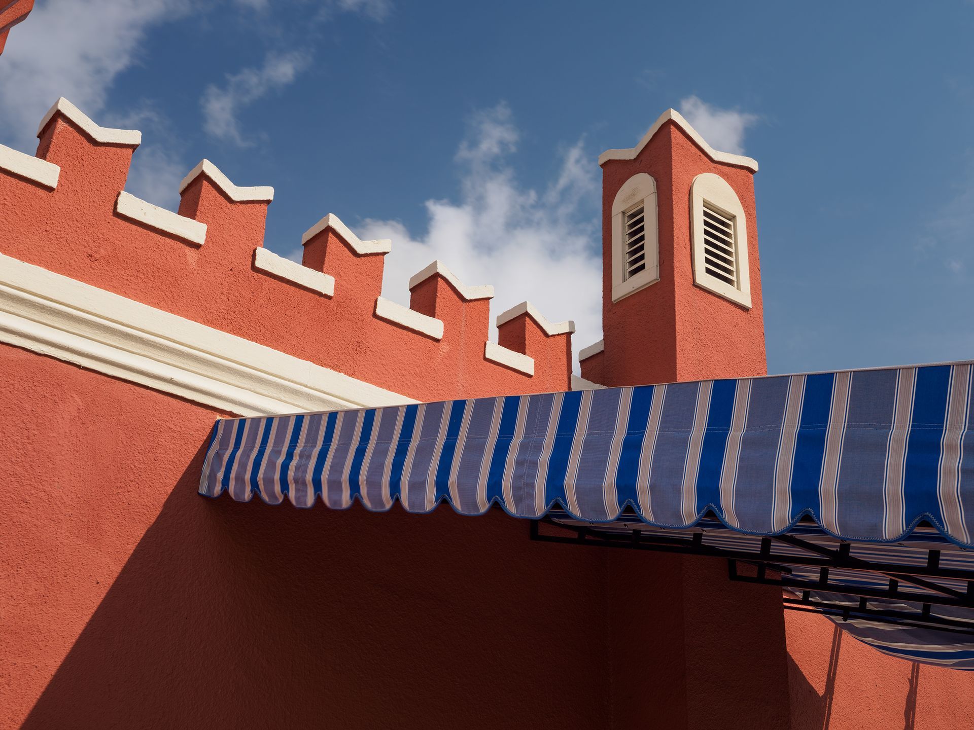 Photo of an awning connecting to a roof