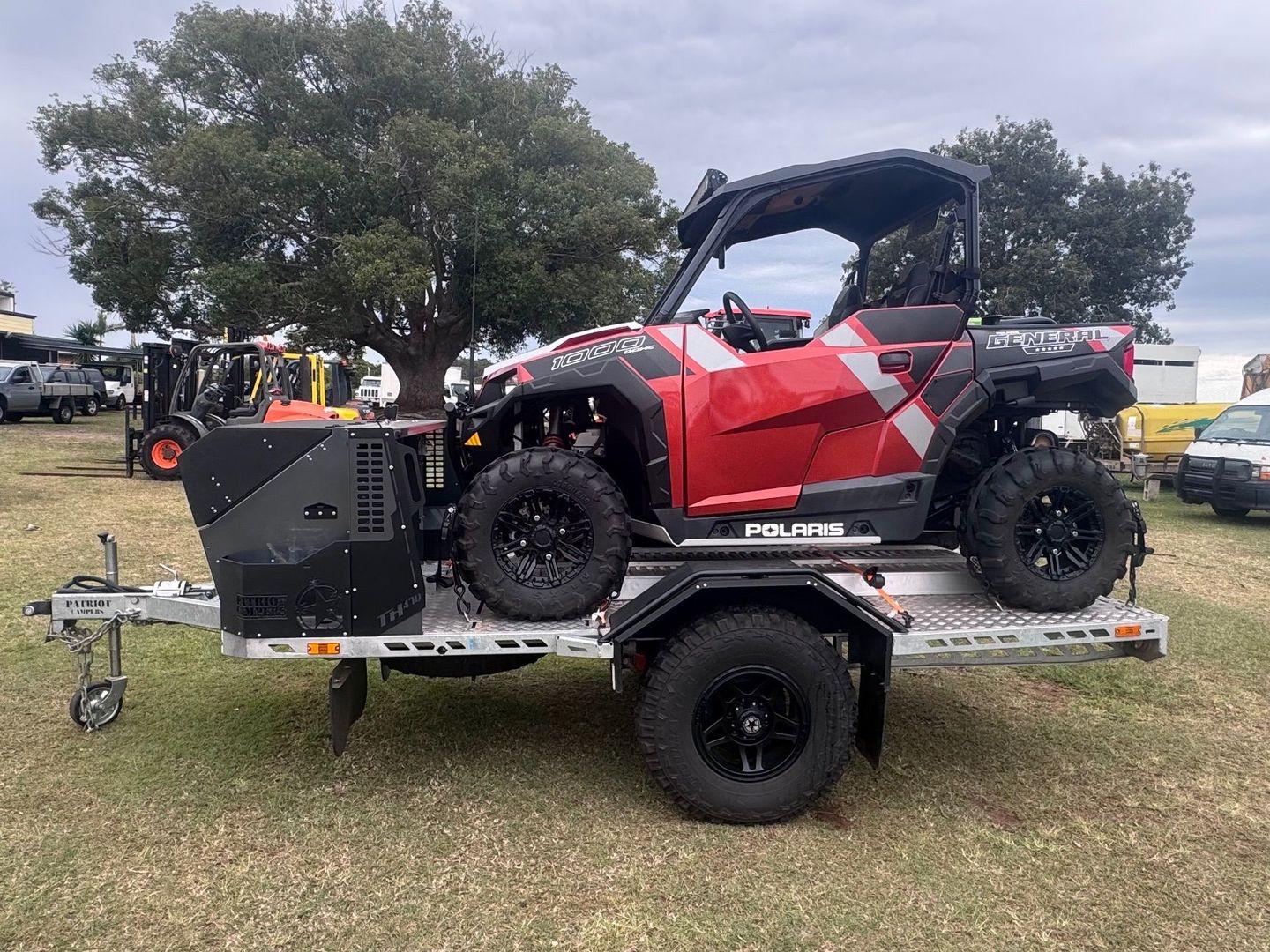 Red and Black ATV on A Trailer — Bundaberg Auction Centre in Gooburrum, QLD