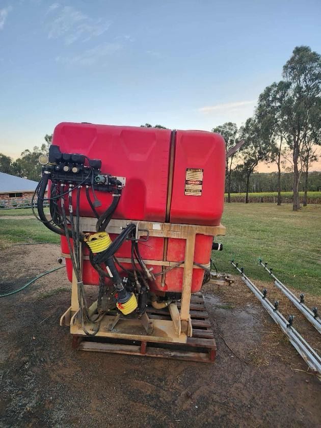 Red Agricultural Sprayer on Wooden Pallet — Bundaberg Auction Centre in Gooburrum, QLD