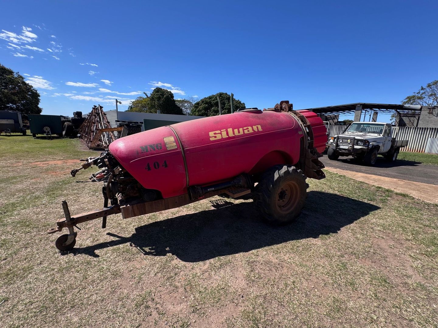 Red Silvan Agricultural Sprayer on A Grassy Field — Bundaberg Auction Centre in Gooburrum, QLD