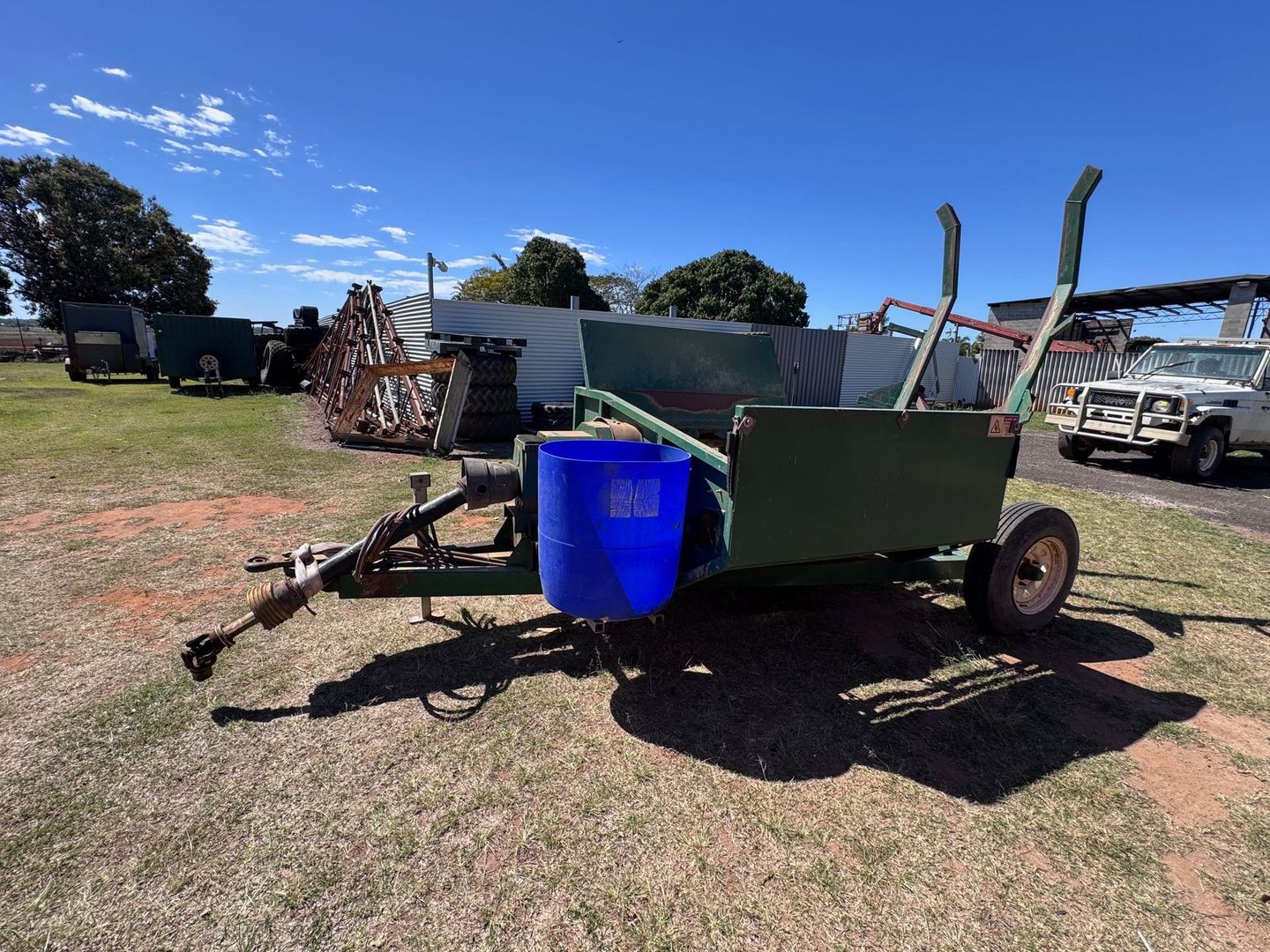 Green Farm Trailer with A Blue Barrel — Bundaberg Auction Centre in Gooburrum, QLD