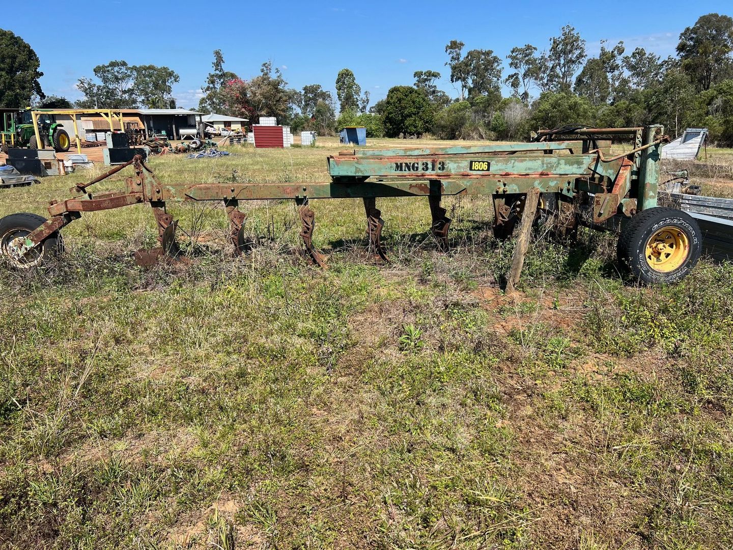 Green and Brown Agricultural Plow in A Grassy Field — Bundaberg Auction Centre in Gooburrum, QLD
