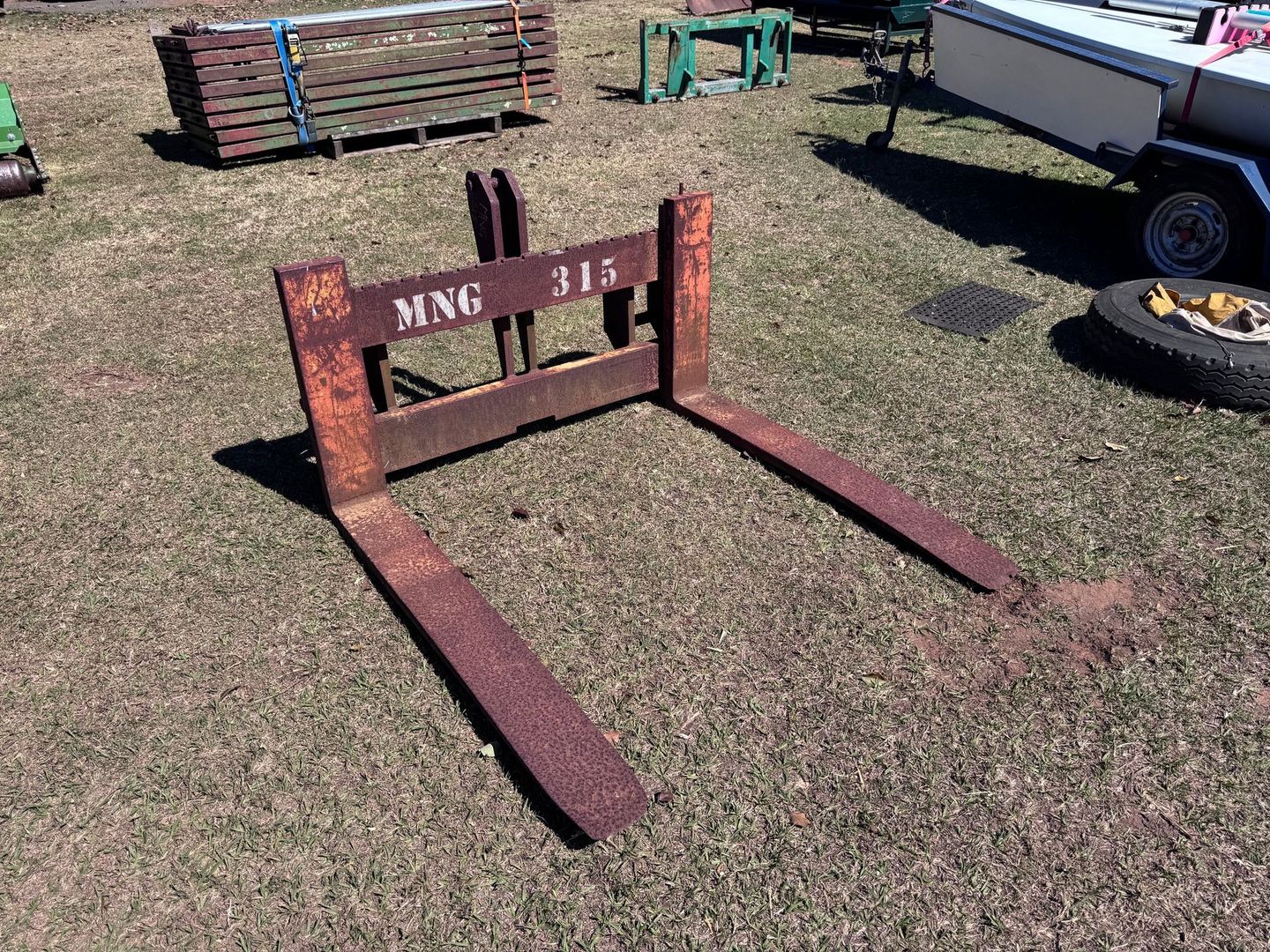 Rusty Forklift Forks on Grass — Bundaberg Auction Centre in Gooburrum, QLD