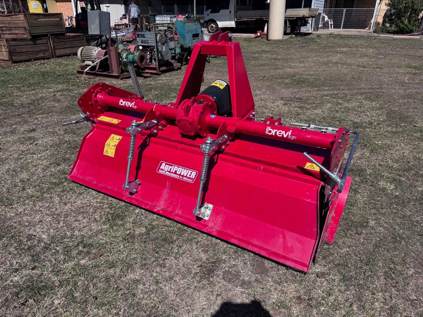 Red Tractor Rotavator on Grass — Bundaberg Auction Centre in Gooburrum, QLD
