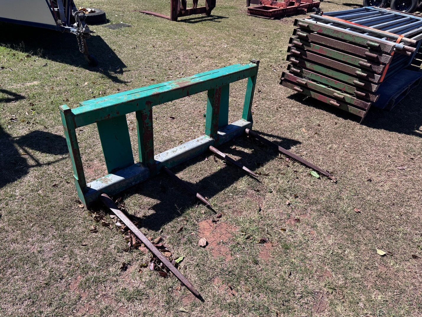 Green Hay Spear Attachment on Grass — Bundaberg Auction Centre in Gooburrum, QLD
