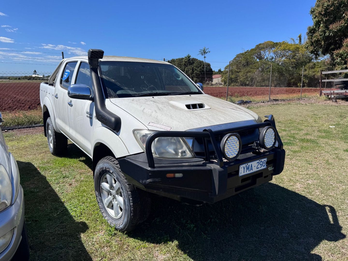 White Toyota Hilux — Bundaberg Auction Centre in Gooburrum, QLD