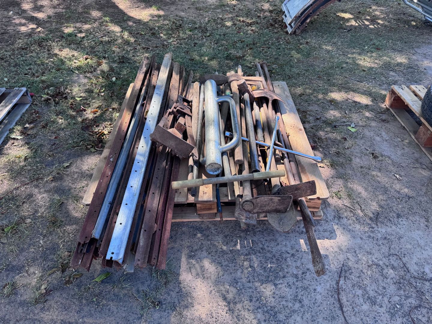 Pile of Metal and Wooden Objects on A Pallet — Bundaberg Auction Centre in Gooburrum, QLD