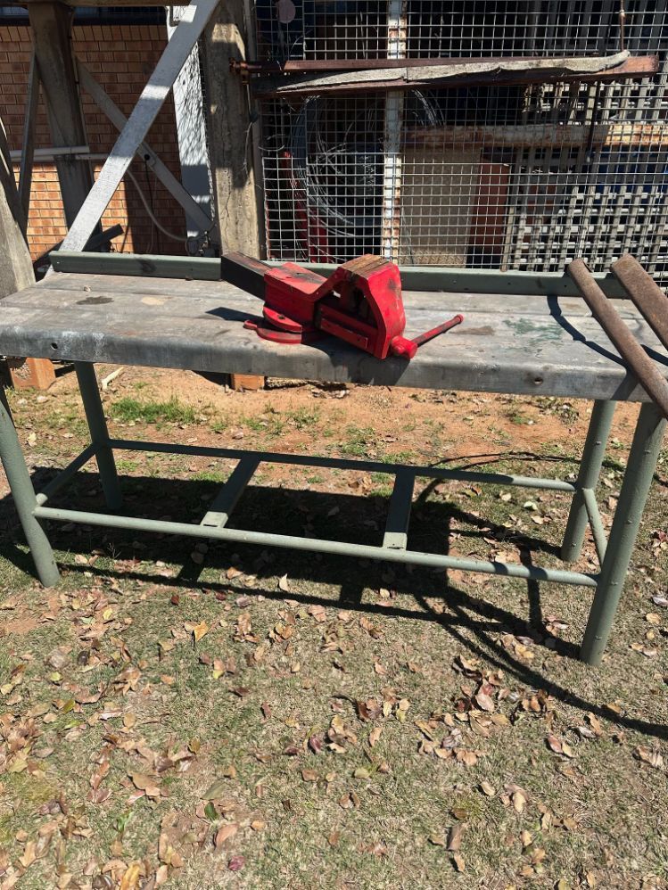 Metal Workbench with Red Vise Outdoors — Bundaberg Auction Centre in Gooburrum, QLD