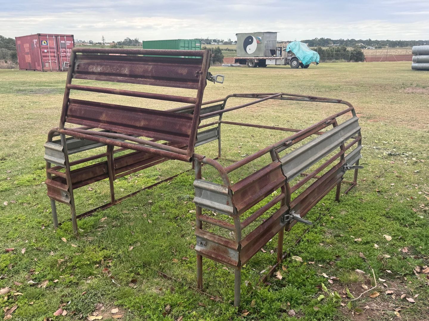 Rusty Metal Cattle Stockyard on Grassy Field — Bundaberg Auction Centre in Gooburrum, QLD